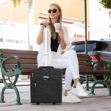 Woman sitting on a bench with Aerolite black cabin luggage, highlighting its stylish design and travel convenience.