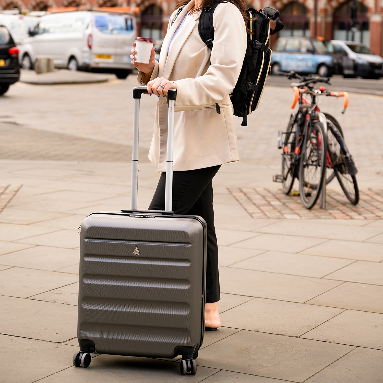 Woman with Aerolite suitcase in urban setting