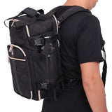 Side view of Aerolite backpack worn by a person, featuring a mesh bottle pocket and adjustable straps for comfortable travel use.